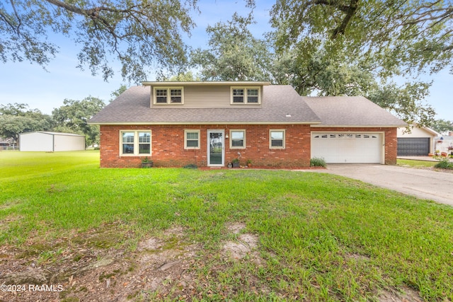 view of front of home featuring a garage and a front lawn