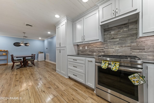 kitchen with white cabinets, light hardwood / wood-style flooring, backsplash, decorative light fixtures, and high end stainless steel range oven