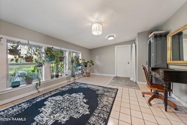 home office with vaulted ceiling and light tile patterned floors