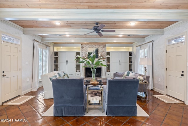 tiled living room featuring crown molding, ceiling fan, and a wealth of natural light