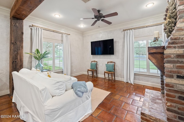 living room featuring ornamental molding and ceiling fan