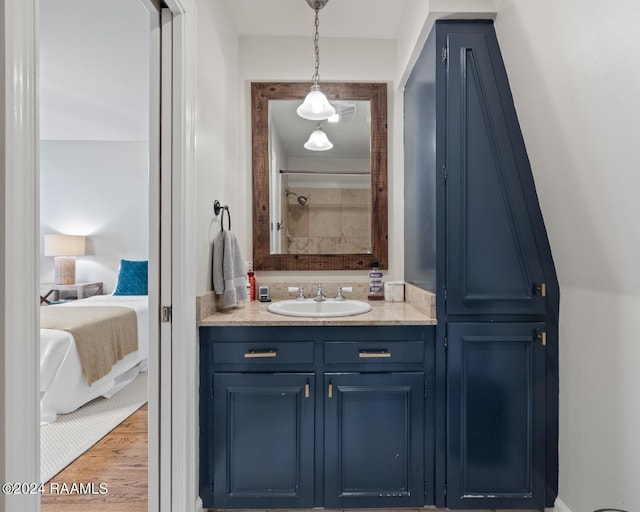 201 Canterbury Rd, Lafayette, LA 70508 - full bathroom with wood finished floors, vanity, and connected bathroom