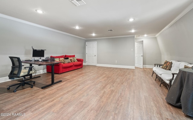 office area with light wood-type flooring and crown molding