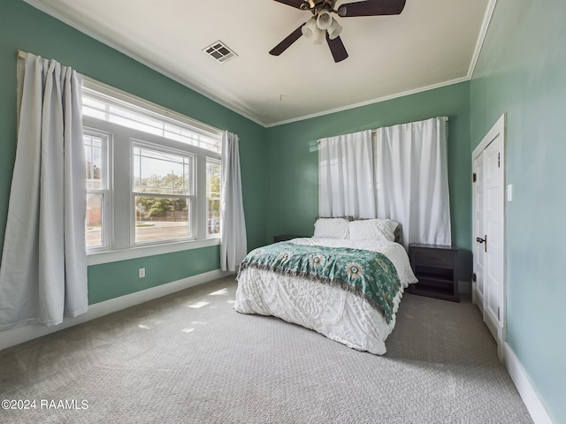 bedroom featuring ceiling fan, carpet floors, and crown molding