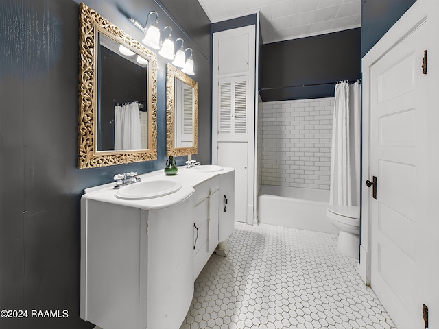 full bathroom featuring shower / tub combo with curtain, tile patterned floors, vanity, and toilet