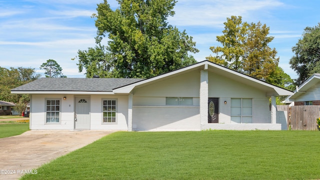 ranch-style house with a front lawn