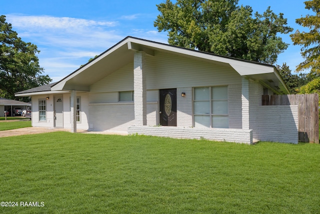 view of front of home with a front yard