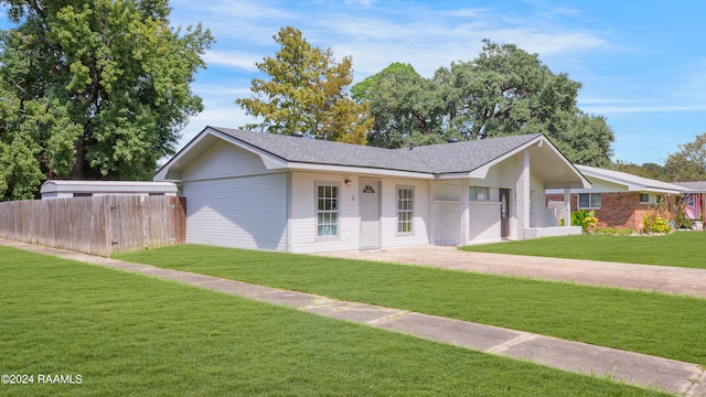 ranch-style house with a front lawn