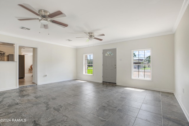 empty room featuring crown molding and ceiling fan