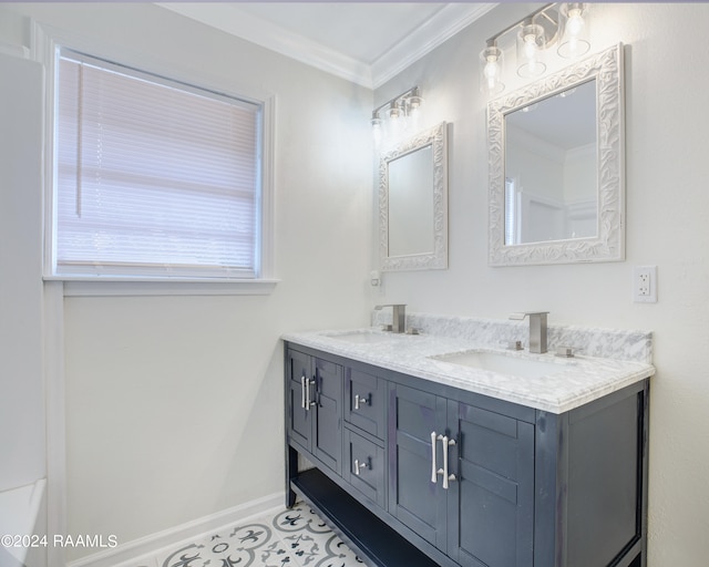 bathroom featuring ornamental molding and vanity