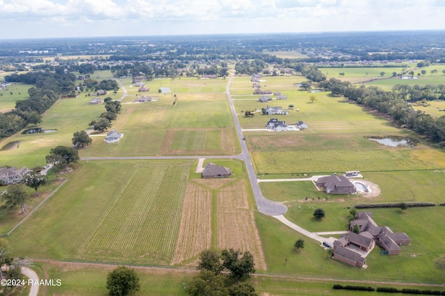 drone / aerial view with a water view and a rural view