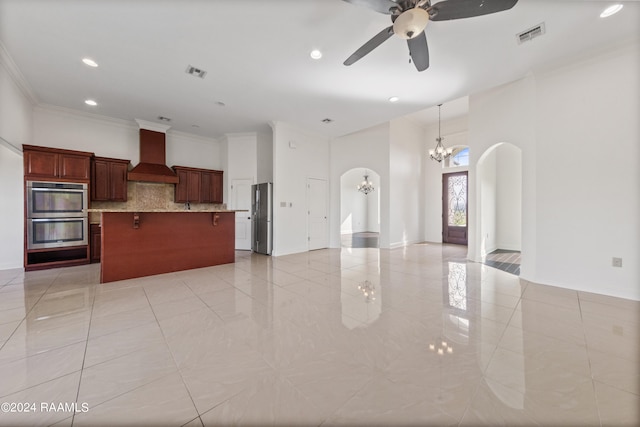 kitchen featuring backsplash, stainless steel appliances, a kitchen bar, custom exhaust hood, and ornamental molding