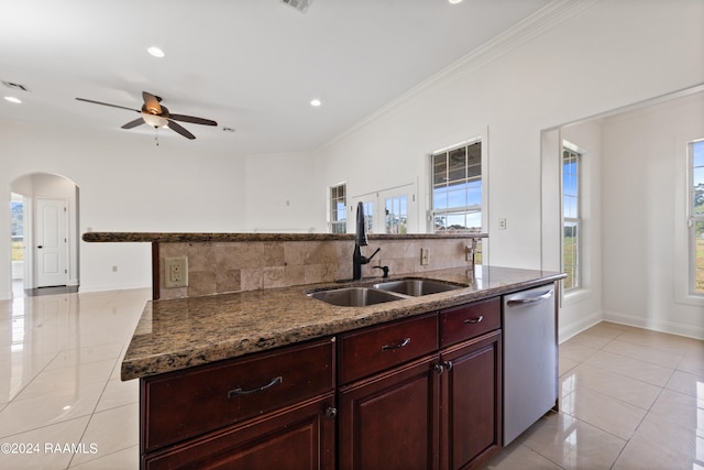 kitchen featuring crown molding, sink, tasteful backsplash, and stainless steel dishwasher