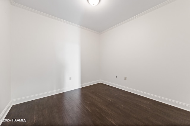 spare room with crown molding and hardwood / wood-style floors