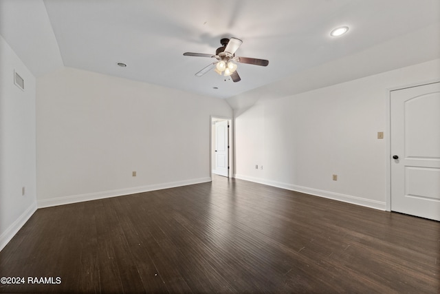 empty room with dark hardwood / wood-style floors and ceiling fan