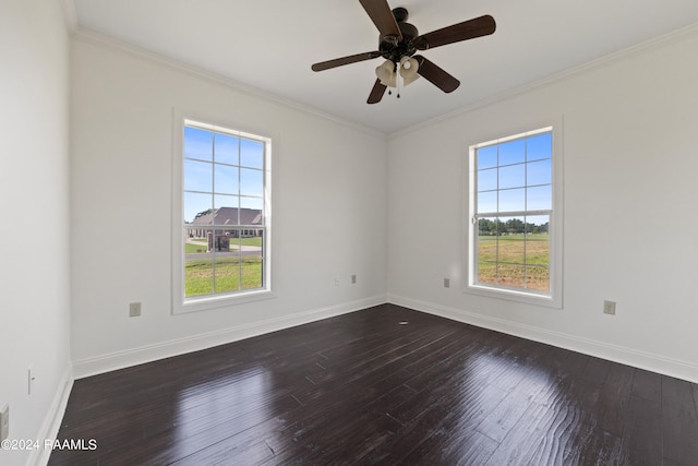 unfurnished room featuring ornamental molding, dark hardwood / wood-style floors, and a healthy amount of sunlight