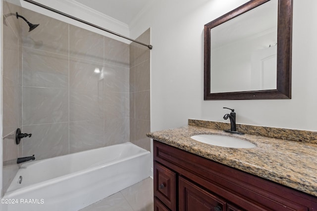 bathroom featuring vanity, tiled shower / bath combo, and ornamental molding