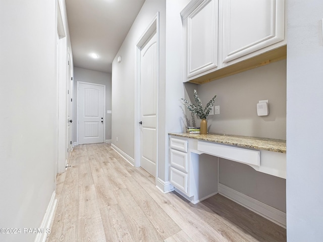 102 Rue Gambetta, Lafayette, LA 70507 - hallway with light wood finished floors, a desk, and baseboards