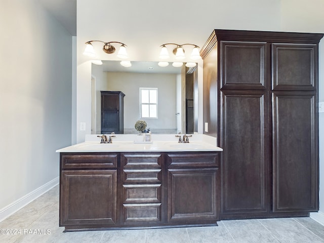 bathroom with tile patterned flooring and vanity