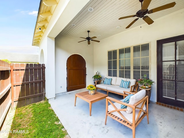 view of patio / terrace with ceiling fan and an outdoor living space