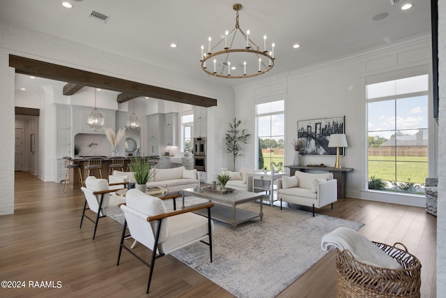 living room featuring plenty of natural light, dark wood-type flooring, and crown molding