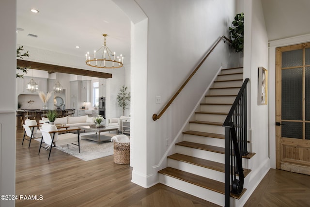 stairs with hardwood / wood-style floors