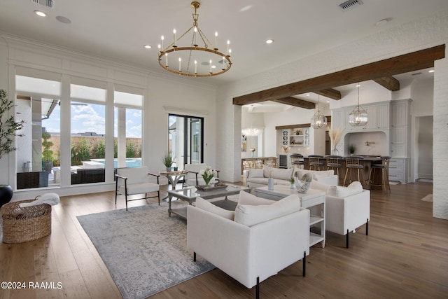 living room featuring beamed ceiling, a chandelier, and dark wood-type flooring