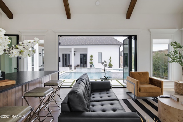 living room with wood-type flooring and beamed ceiling