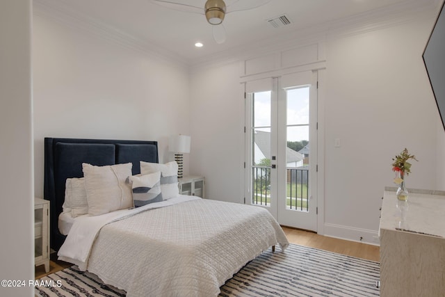 bedroom with ornamental molding, light hardwood / wood-style floors, ceiling fan, and access to exterior