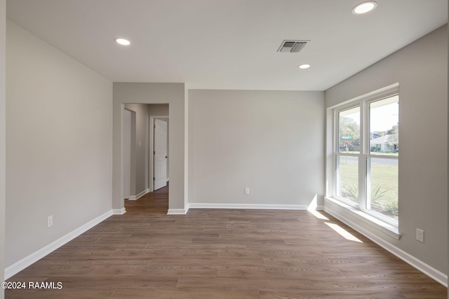 empty room with dark wood-type flooring