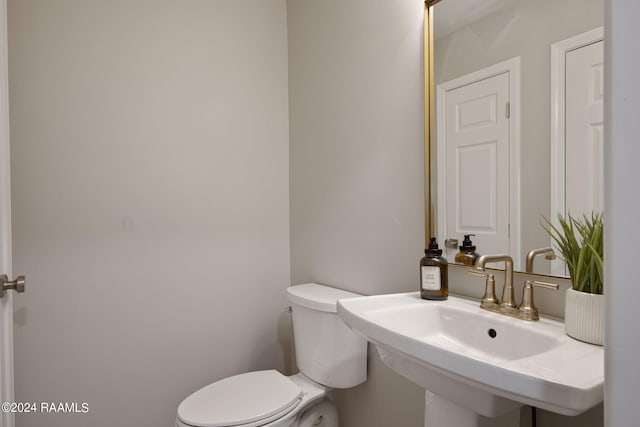 bathroom with sink and toilet