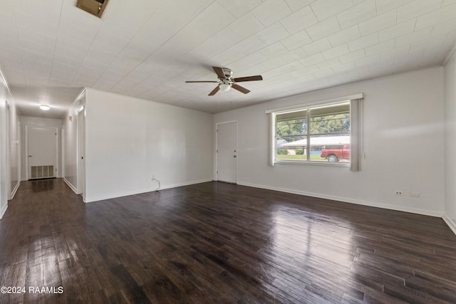 spare room with ceiling fan and dark hardwood / wood-style floors