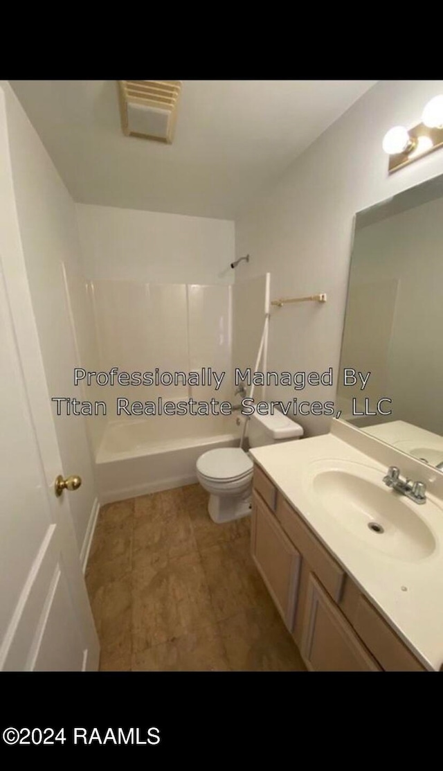 full bathroom with bathtub / shower combination, vanity, and toilet