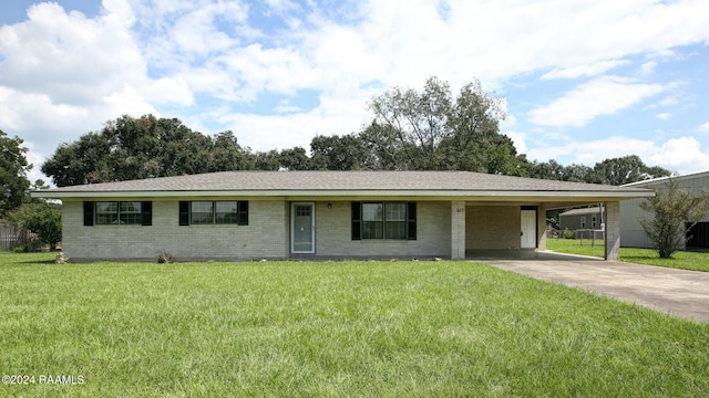 ranch-style house featuring a front lawn and a carport