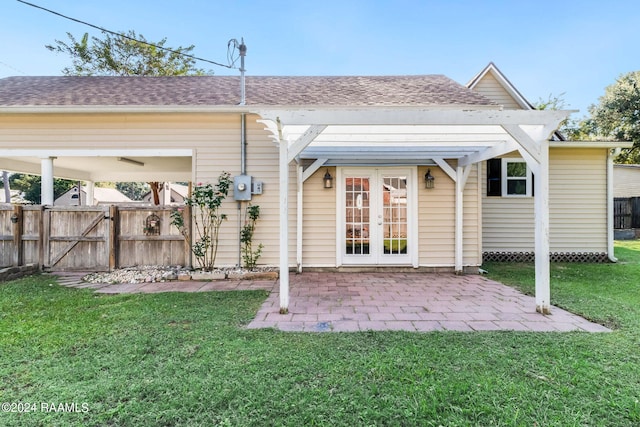 back of house featuring french doors, a yard, and a patio