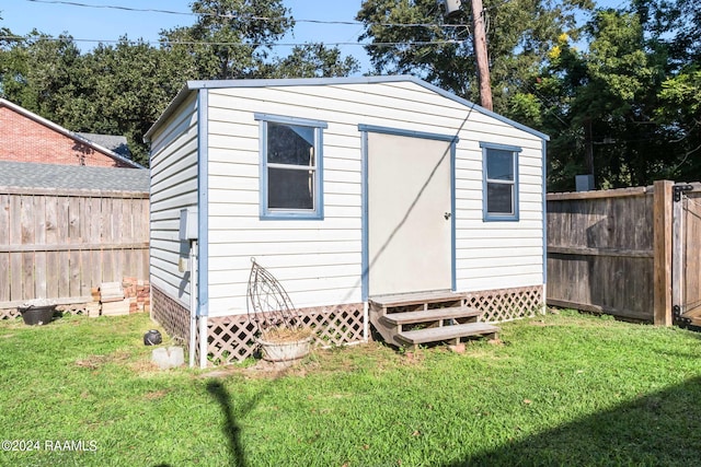 view of outdoor structure featuring a yard