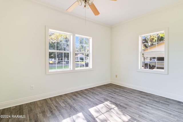 empty room featuring wood-type flooring, crown molding, and ceiling fan