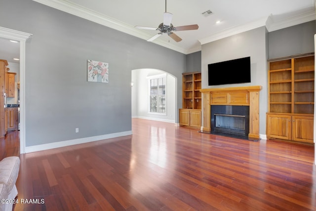 unfurnished living room featuring ceiling fan, crown molding, and dark hardwood / wood-style flooring