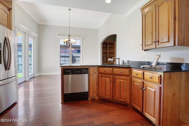 kitchen with appliances with stainless steel finishes, plenty of natural light, and sink