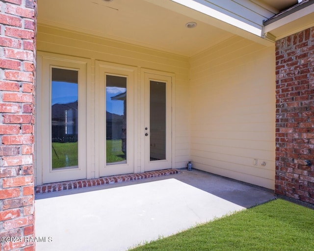 doorway to property featuring a patio area and french doors