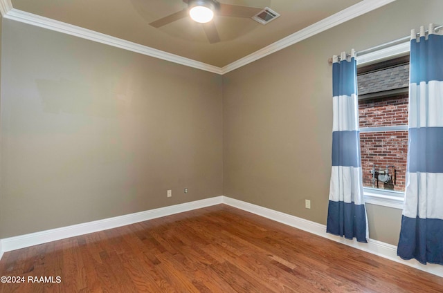 unfurnished room with wood-type flooring, crown molding, and ceiling fan