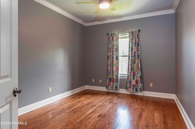 unfurnished room with ornamental molding, ceiling fan, and hardwood / wood-style flooring