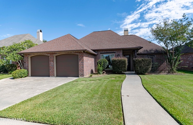 view of front of home with a garage and a front yard