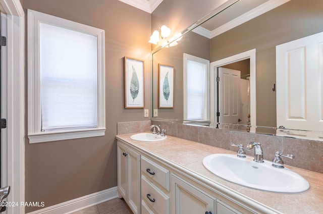 bathroom with ornamental molding, tile patterned floors, and vanity