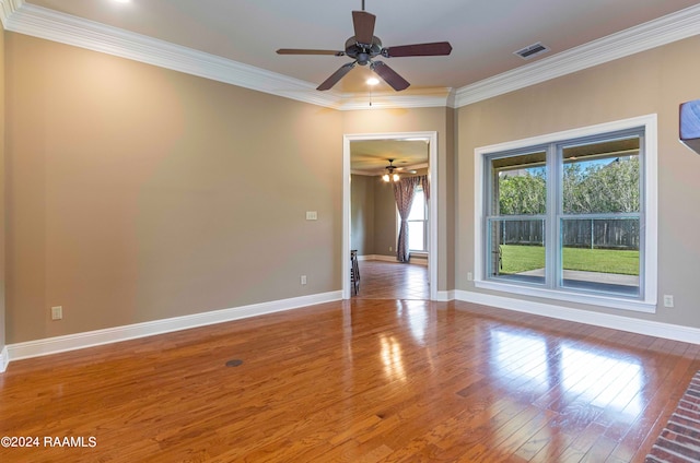 unfurnished room featuring ceiling fan, hardwood / wood-style flooring, and crown molding