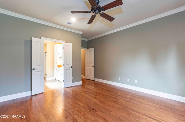 unfurnished bedroom with crown molding, light hardwood / wood-style floors, and ceiling fan