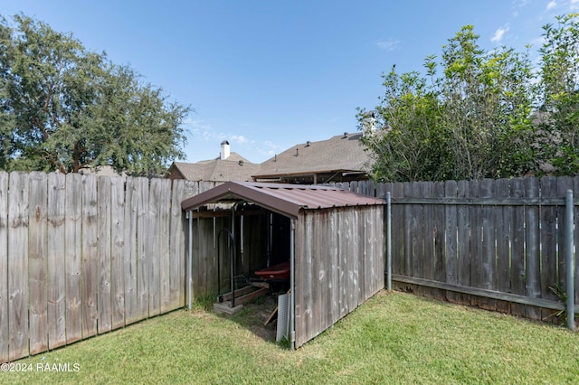 view of outdoor structure featuring a lawn