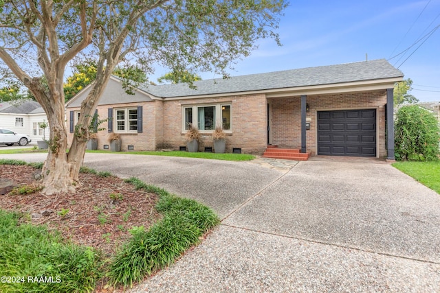 ranch-style home featuring a garage