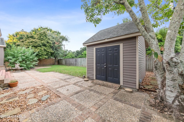 view of patio / terrace with a storage unit