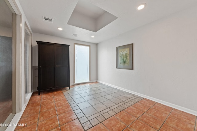 unfurnished bedroom featuring tile patterned flooring